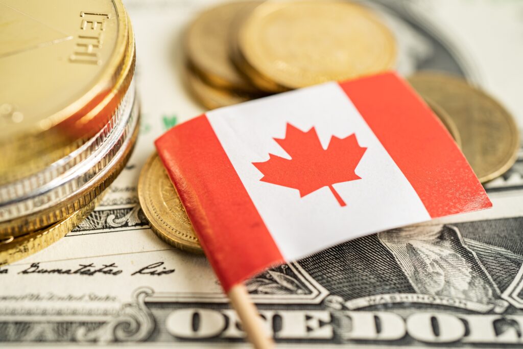 Stack of coins money with Canada flag, finance banking concept.